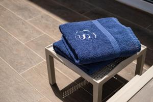a blue towel sitting on top of a stool at The Segond Hotel in Xagħra