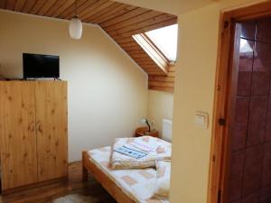 Postel nebo postele na pokoji v ubytování Sóhegy Panzió
