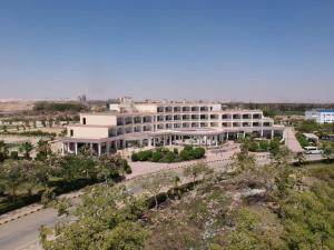 an aerial view of a large white building at Assiut Cement Hotel in Asyut