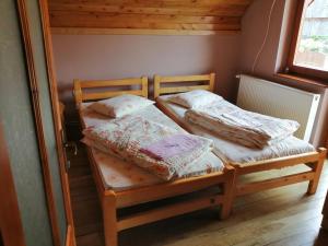 Postel nebo postele na pokoji v ubytování Sóhegy Panzió