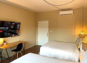 Cama ou camas em um quarto em Magnolia Inn