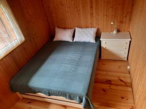 Posteľ alebo postele v izbe v ubytovaní Domek JEZIORACZEK BIS