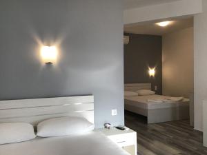 Postel nebo postele na pokoji v ubytování Be Happy Apartments