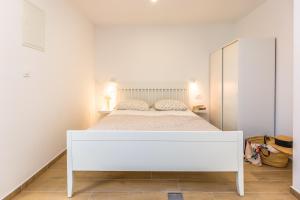 Postel nebo postele na pokoji v ubytování Adris apartments