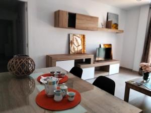 A seating area at Apto. Escolano, Playa de la Cachucha. WiFi, A/C
