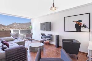 TV a/nebo společenská místnost v ubytování Casa Energía del Cabo. San Jose Cabo de Gata.