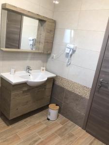Koupelna v ubytování Tasos Cozy House + 37 fotografií