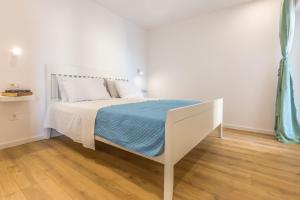 Postel nebo postele na pokoji v ubytování Adris apartments