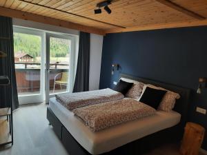 Ένα ή περισσότερα κρεβάτια σε δωμάτιο στο Ferienhaus Enzian