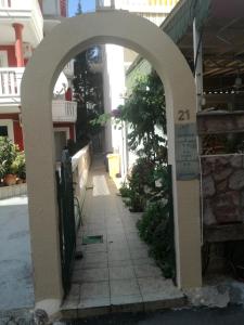 an archway over a sidewalk in a building at Miron apart&rooms in Rafailovici