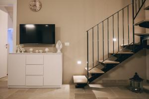 TV i/ili multimedijalni sistem u objektu Suite Matteotti