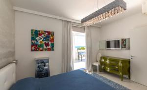מיטה או מיטות בחדר ב-Magnifico appartamento Dominique Jesolo Lido Carraro Immobiliare - Family Apartments