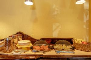 a table with a tray of food on it at Pousada Y-Goá in Bertioga