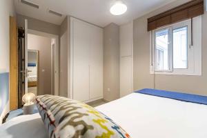 Posteľ alebo postele v izbe v ubytovaní Sur Suites El Cano 2