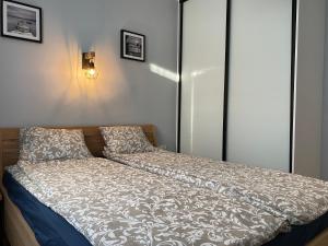 Posteľ alebo postele v izbe v ubytovaní APARTAMENT KRZYŚ