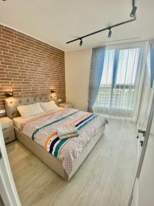 Säng eller sängar i ett rum på New design apartment in Chișinău
