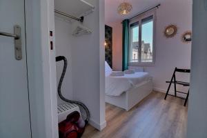 מיטה או מיטות בחדר ב-Appartement INDU Centre ville de VITRÉ