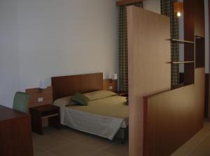Letto o letti in una camera di Hermes Hotel