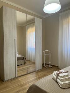A bed or beds in a room at Casa vacanze l’orchidea