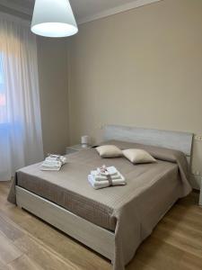 A bed or beds in a room at Casa vacanze l’orchidea