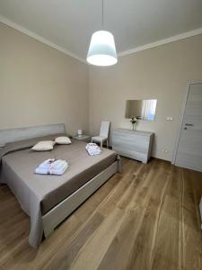 A bed or beds in a room at Casa vacanze l’orchidea