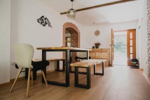 a dining room with a table and two chairs at Gorska Vila mountain villa in Soča