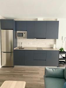 Kuchyň nebo kuchyňský kout v ubytování Precioso Apartamento Conil AIRE ACONDICIONADO Y WIFI -SOLO FAMILIAS Y PAREJAS-