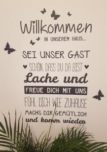 a wall sticker with the words willuminati in universal has set unseen east at Ferienwohnung Andrejcic in Feistritz im Rosental