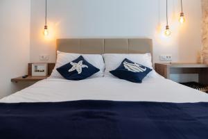 Posteľ alebo postele v izbe v ubytovaní Vitelli Apartments and Rooms