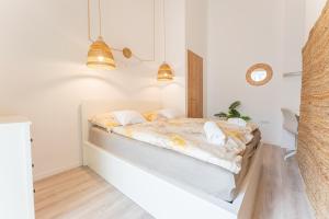 Posteľ alebo postele v izbe v ubytovaní Maison de Fashion Apartment
