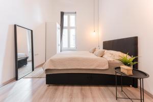 Posteľ alebo postele v izbe v ubytovaní Maison de Fashion Apartment