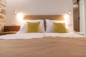 Posteľ alebo postele v izbe v ubytovaní Vitelli Apartments and Rooms