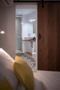 Posteľ alebo postele v izbe v ubytovaní Vitelli Apartments and Rooms