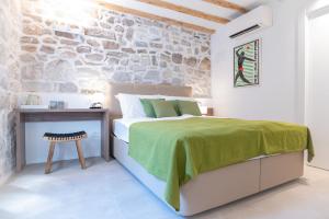 Posteľ alebo postele v izbe v ubytovaní Vitelli Apartments and Rooms