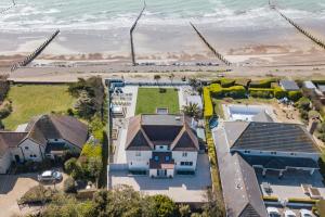 an aerial view of a house and the beach at Sun Beach House in Middleton-on-Sea