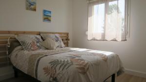 Postel nebo postele na pokoji v ubytování Appartement chaleureux et élégant en résidence.