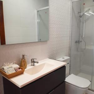 Kúpeľňa v ubytovaní Apartamentos Mar de Nanín