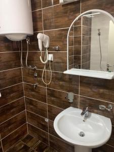 a bathroom with a sink and a mirror at Apartment Dunja in Boreti +67 photos