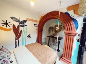 Postel nebo postele na pokoji v ubytování 13 Cielos Hostel & Coworking