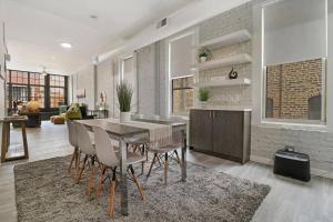a kitchen and dining room with a table and chairs at Wonderful 2BR Apartment close to Restaurants- Hubbard 4 in Chicago