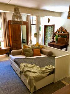 a bedroom with a large bed in a room at Chez Luis et David in Avignonet-de-Lauragais
