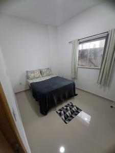 En eller flere senger på et rom på VidigalHouse apartamento Vista Mar 2