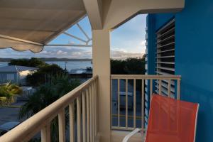 a balcony with a view of the ocean at Red Sunset Beach Club in Boqueron