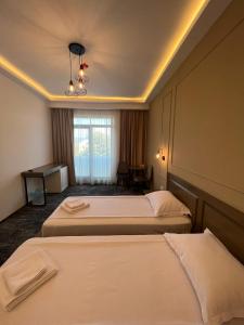 Llit o llits en una habitació de Hotel Padesul