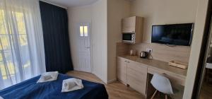 Łóżko lub łóżka w pokoju w obiekcie Apartamenty Hexagon nr 11