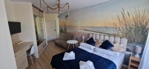 Łóżko lub łóżka w pokoju w obiekcie Apartamenty Hexagon nr 11