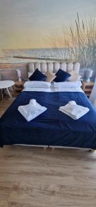 Łóżko lub łóżka w pokoju w obiekcie Apartamenty Hexagon nr 11