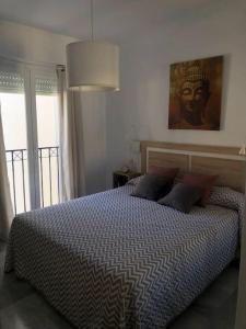 A bed or beds in a room at Encantador apartamento residencial con piscina
