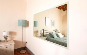 A bed or beds in a room at Cozy Home In Barberino Del Mugello