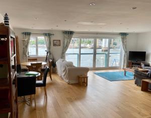 a living room with a view of the water at Tamar View in Plymouth